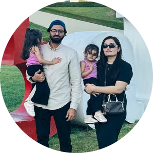 Alqama Faisal and her family visiting the I Love Baku sign in Azerbaijan