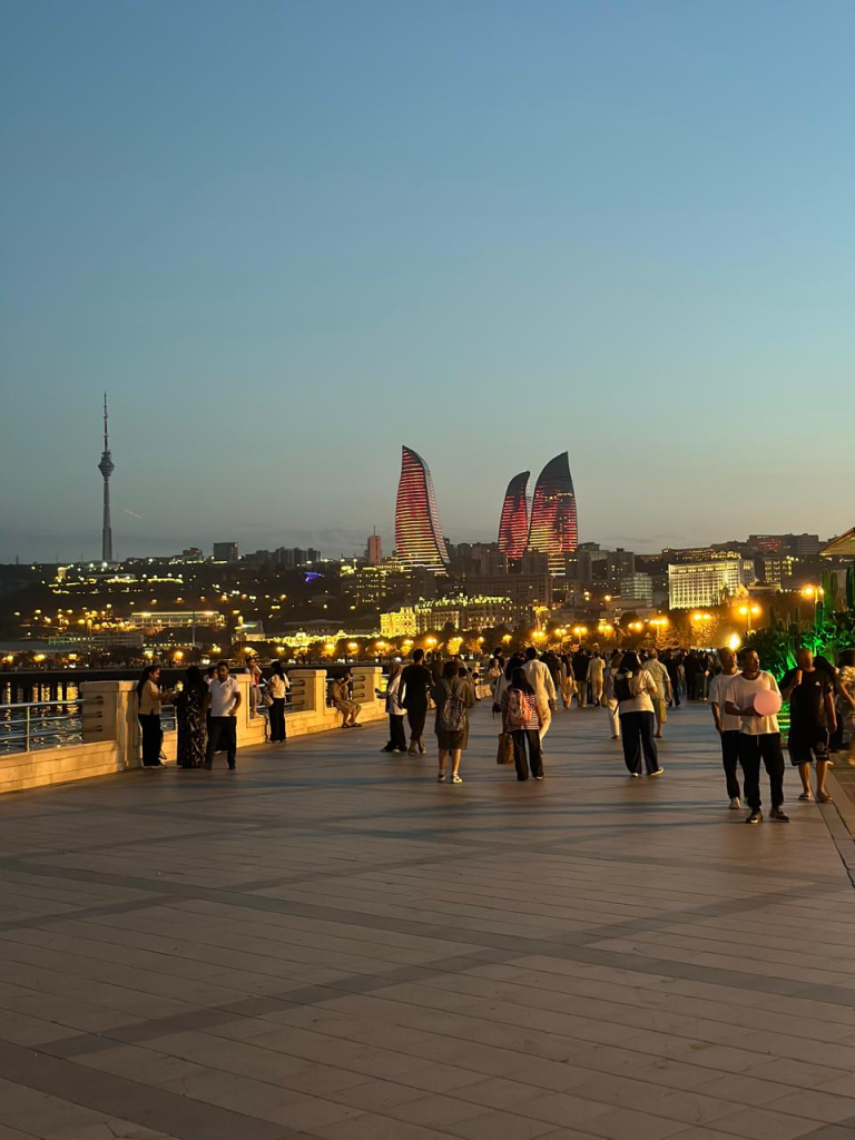 Baku Boulevard at night with the illuminated Flame Towers and Baku TV Tower