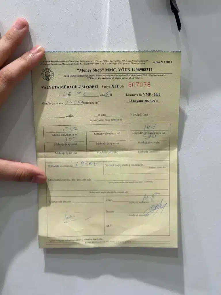 Currency exchange receipt at 28 May shop in Baku