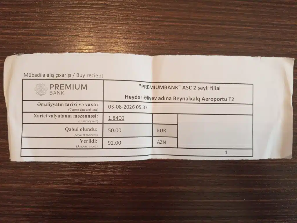 Currency exchange receipt from Premium Bank at Heydar Aliyev International Airport in Baku