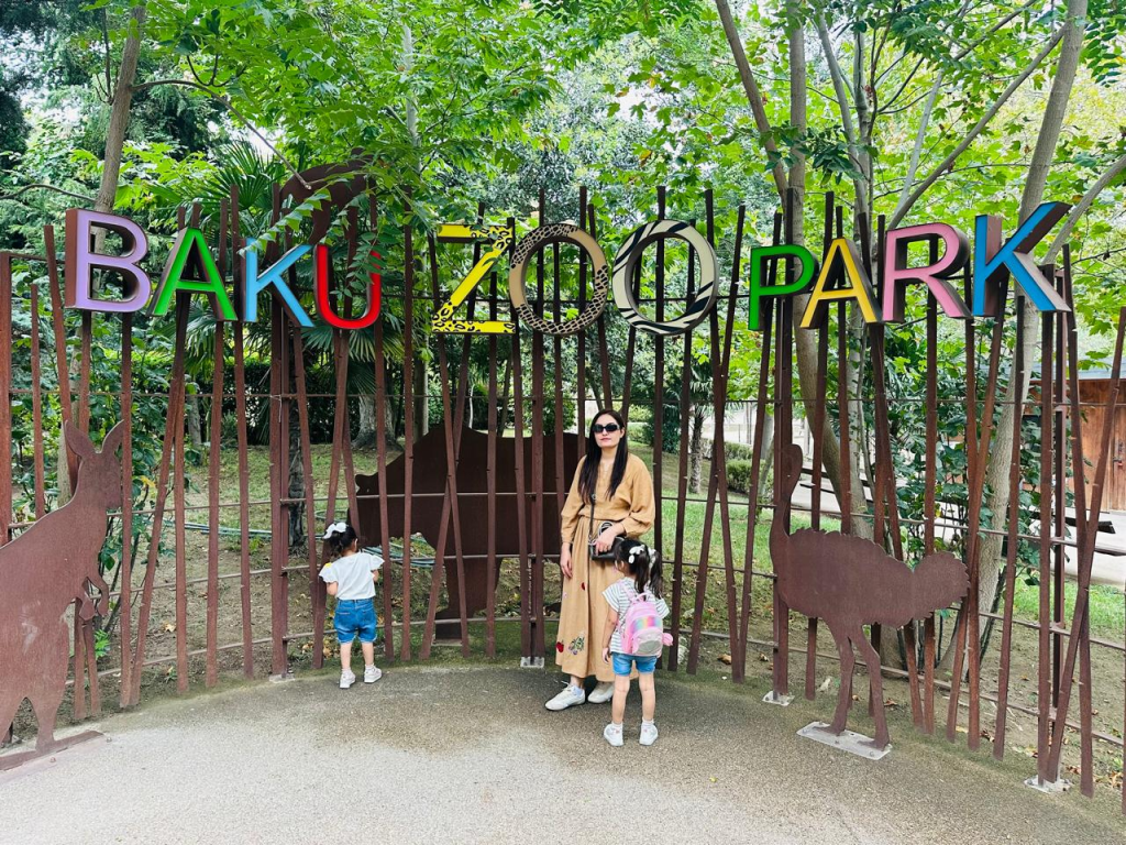 Family visiting Baku Zoo in Azerbaijan with two young children