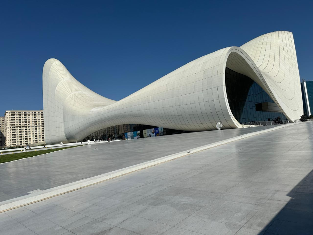 Heydar Aliyev Center under a blue sky in Baku