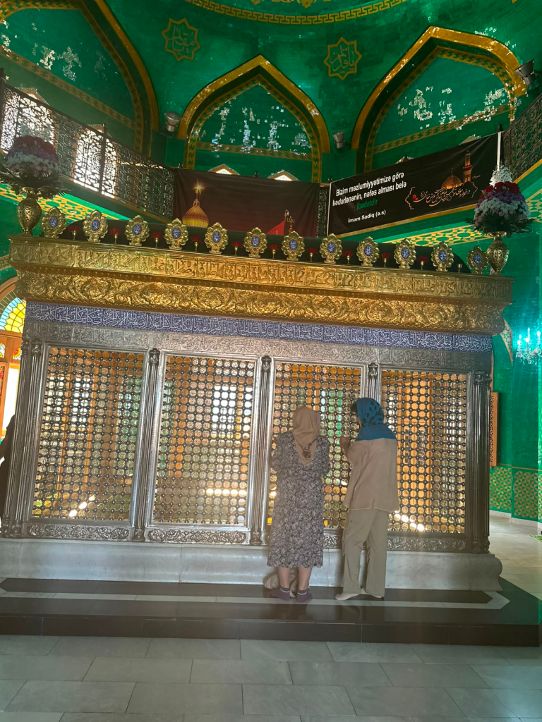 Visitors praying at the shrine inside Bibi-Heybat Mosque in Baku, Azerbaijan